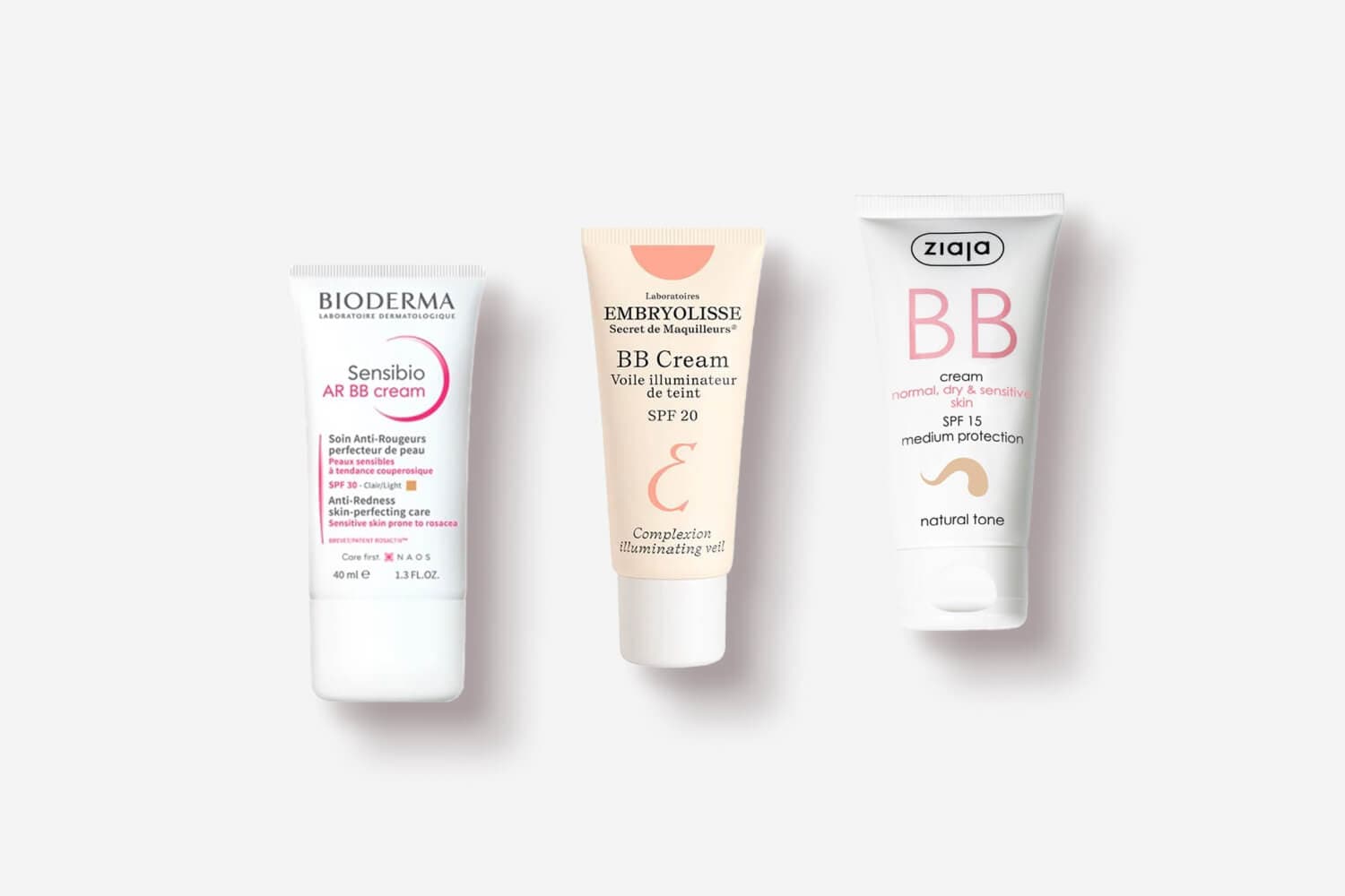 Bioderma Sensibio AR BB Cream SPF 30 Light, Embryolisse BB Cream SPF 20 and Ziaja BB Cream SPF 15 Natural Tone tubes on grey. Bioderma Sensibio AR BB Cream SPF 30 Light, Embryolisse BB Cream SPF 20 and Ziaja BB Cream SPF 15 Natural Tone tubes on grey.