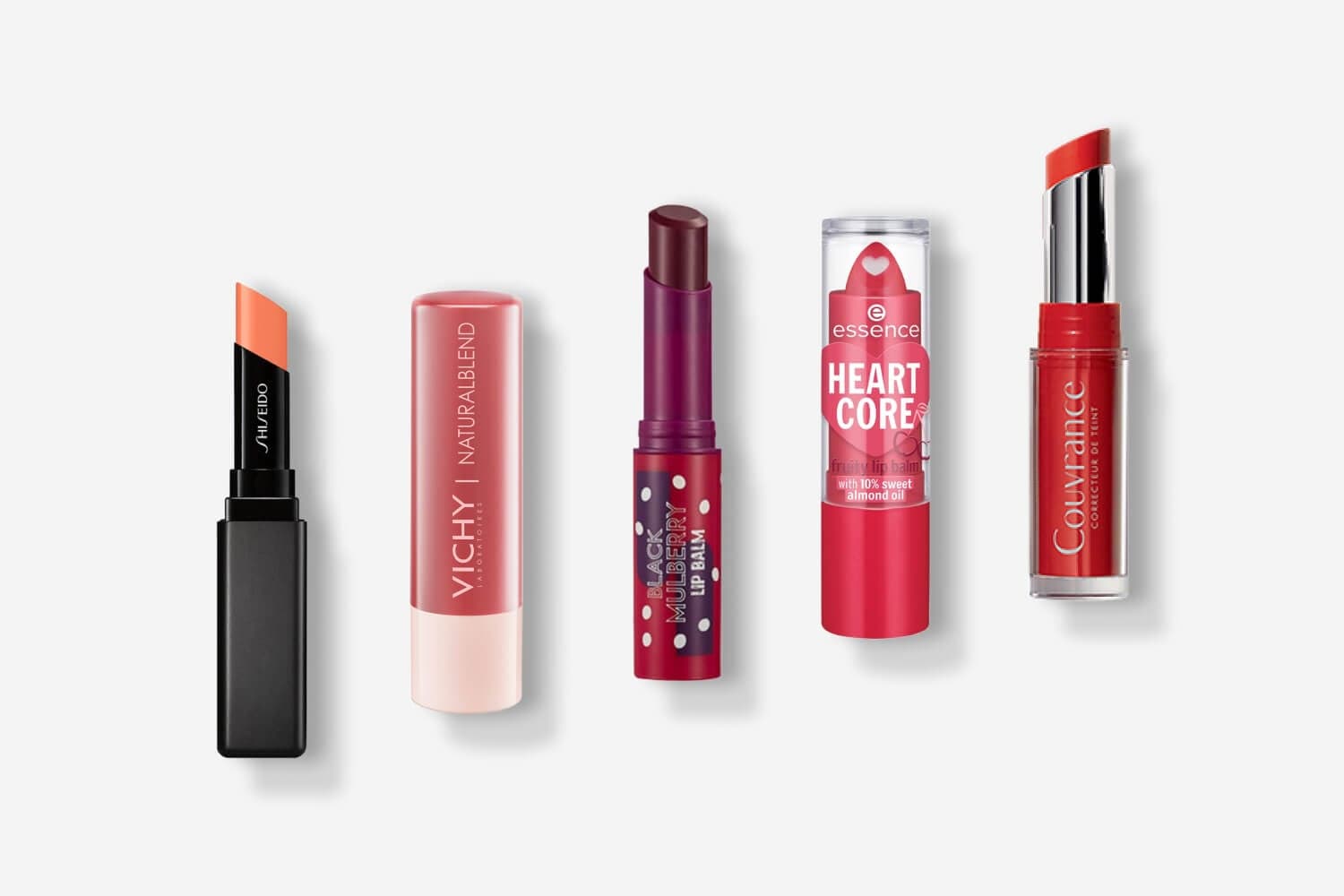 Five lip balms in a row: Shiseido in coral, Vichy Naturalblend, a Black Mulberry Lip Balm, essence Heart Core and Avène Couvrance in red. Five lip balms in a row: Shiseido in coral, Vichy Naturalblend, a Black Mulberry Lip Balm, essence Heart Core and Avène Couvrance in red.