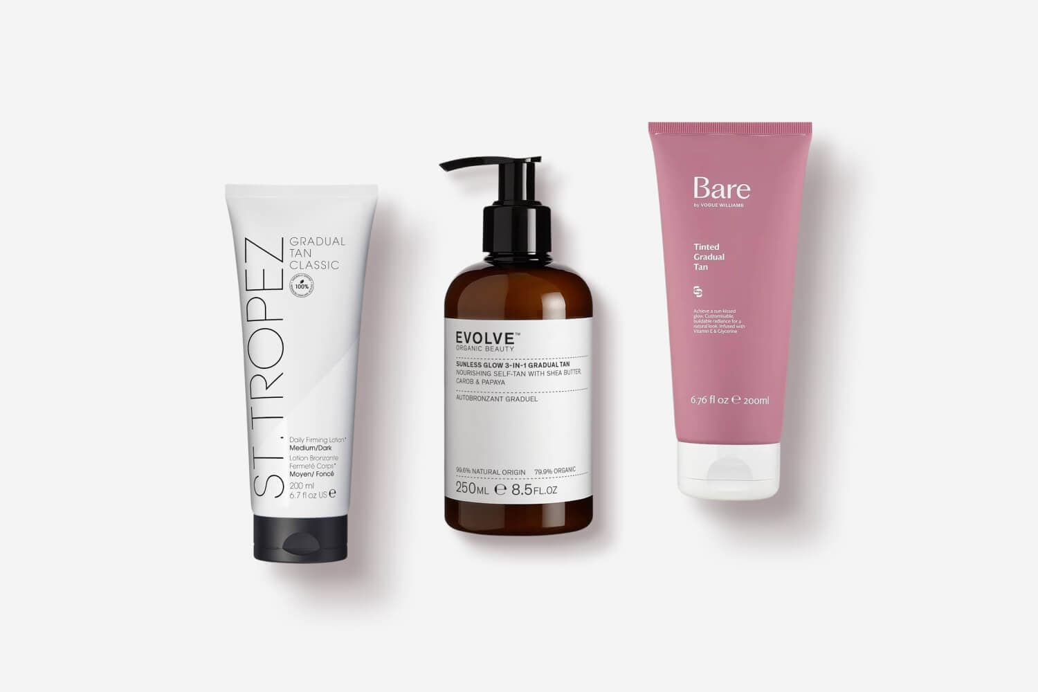 St. Tropez Gradual Tan Classic, Evolve Organic Beauty Sunless Glow 3-in-1 and Bare by Vogue Williams Tinted Gradual Tan on grey. St. Tropez Gradual Tan Classic, Evolve Organic Beauty Sunless Glow 3-in-1 and Bare by Vogue Williams Tinted Gradual Tan on grey.