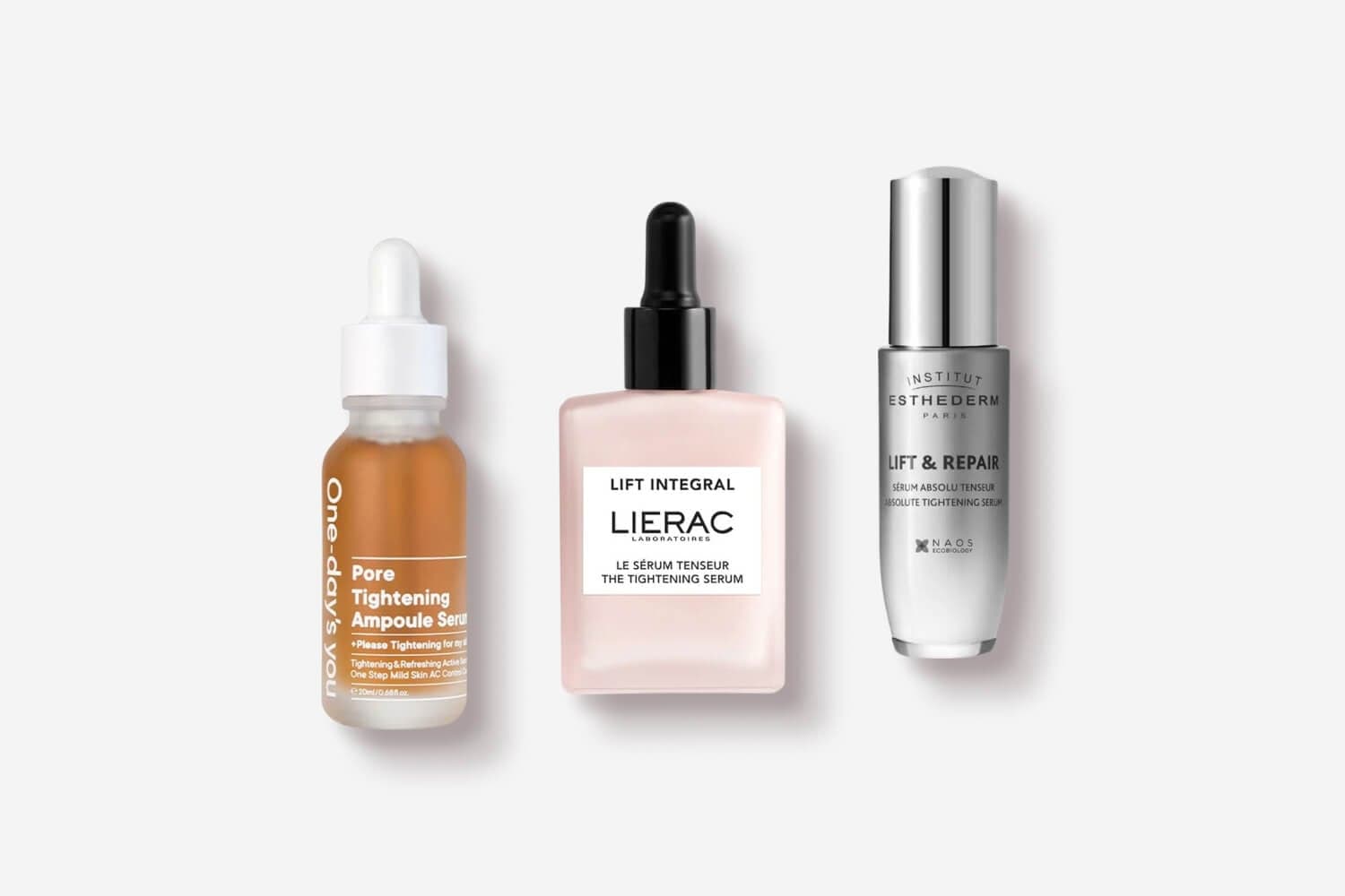 One-day's You Pore Tightening Ampoule Serum, Lierac Lift Integral The Tightening Serum and Institut Esthederm Lift & Repair serum on grey. One-day's You Pore Tightening Ampoule Serum, Lierac Lift Integral The Tightening Serum and Institut Esthederm Lift & Repair serum on grey.