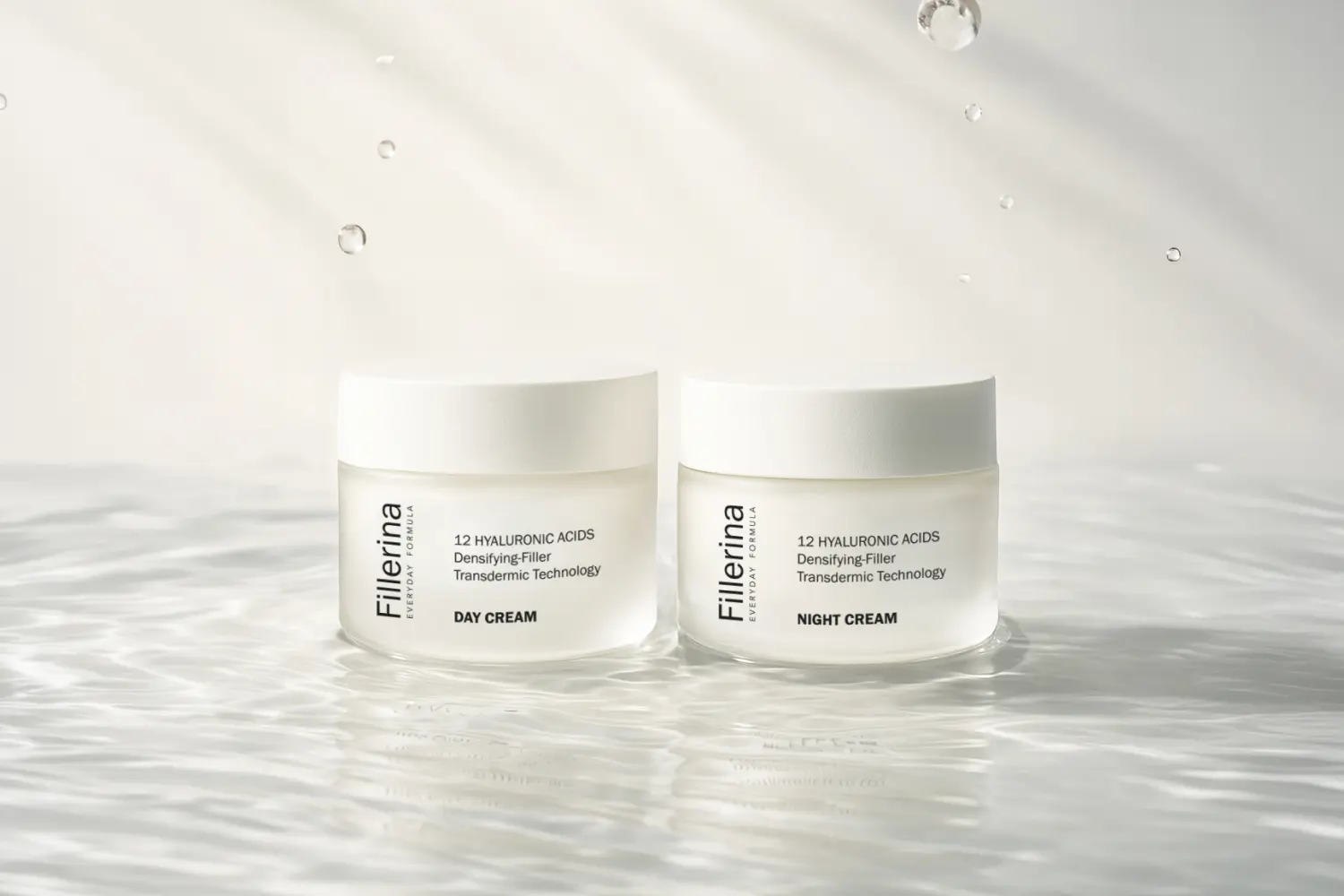 Fillerina Everyday Formula 12 Hyaluronic Acids Day Cream and Night Cream jars standing in rippling water Fillerina Everyday Formula 12 Hyaluronic Acids Day Cream and Night Cream jars standing in rippling water