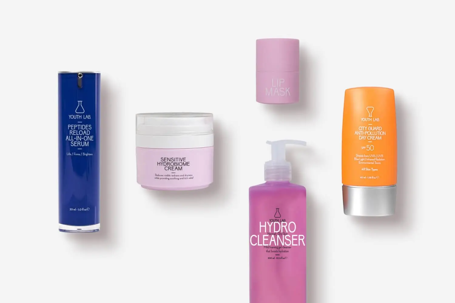 YOUTH LAB Peptides Reload All-in-One Serum, Sensitive Hydrobiome Cream, Lip Mask, Hydro Cleanser and City Guard Anti-Pollution Day Cream SPF 50 on grey. YOUTH LAB Peptides Reload All-in-One Serum, Sensitive Hydrobiome Cream, Lip Mask, Hydro Cleanser and City Guard Anti-Pollution Day Cream SPF 50 on grey.