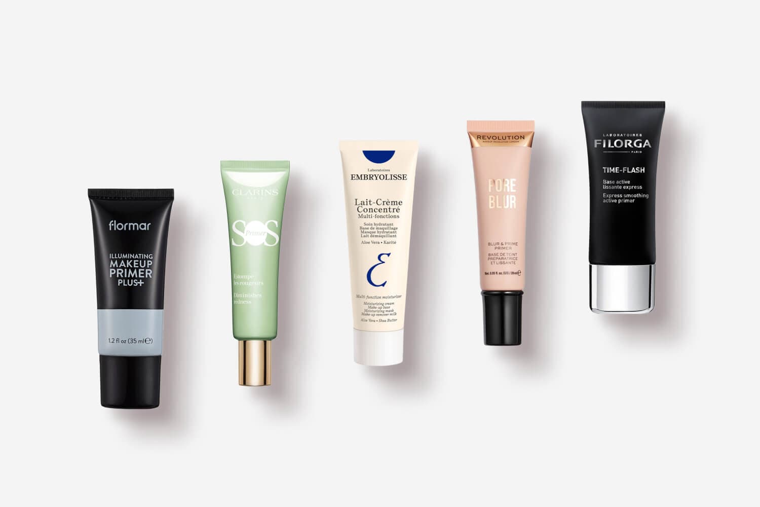 Flormar Illuminating Makeup Primer Plus+, Clarins SOS Primer, Embryolisse Lait-Crème Concentré, Revolution Pore Blur and Filorga Time-Flash tubes in a row. Flormar Illuminating Makeup Primer Plus+, Clarins SOS Primer, Embryolisse Lait-Crème Concentré, Revolution Pore Blur and Filorga Time-Flash tubes in a row.