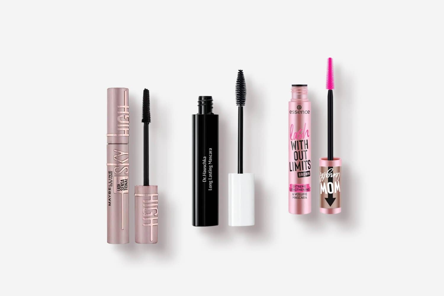 Maybelline Lash Sensational Sky High, Dr. Hauschka Long Lasting Mascara and essence Lash Without Limits Brown, wands beside each tube. Maybelline Lash Sensational Sky High, Dr. Hauschka Long Lasting Mascara and essence Lash Without Limits Brown, wands beside each tube.