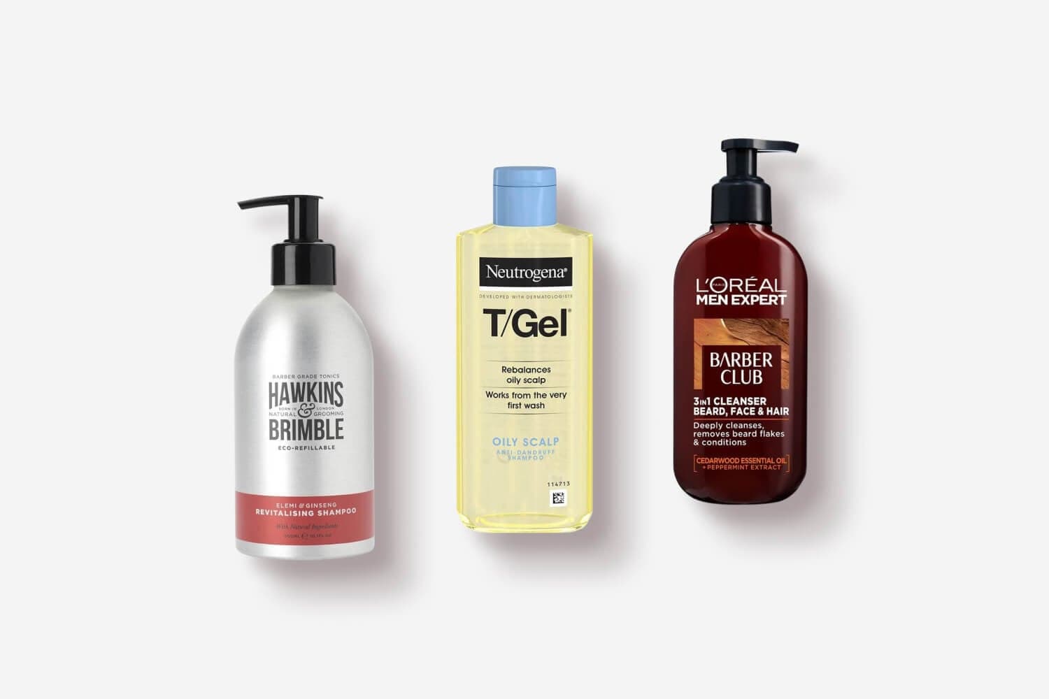 Hawkins & Brimble Elemi & Ginseng Revitalising Shampoo, Neutrogena T/Gel Oily Scalp and L'Oréal Men Expert Barber Club 3-in-1 Cleanser bottles on grey. Hawkins & Brimble Elemi & Ginseng Revitalising Shampoo, Neutrogena T/Gel Oily Scalp and L'Oréal Men Expert Barber Club 3-in-1 Cleanser bottles on grey.