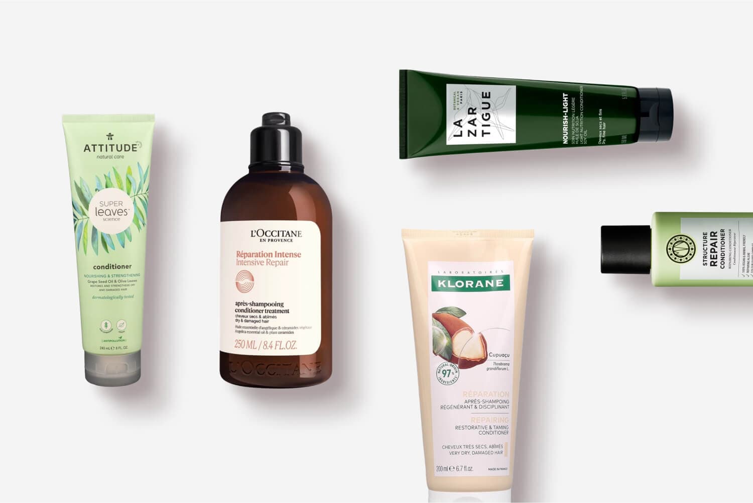 Attitude Super Leaves, L'Occitane Réparation Intense, La Biosthétique Lazartigue Nourish-Light, Klorane Cupuaçu and Structure Repair conditioners on grey Attitude Super Leaves, L'Occitane Réparation Intense, La Biosthétique Lazartigue Nourish-Light, Klorane Cupuaçu and Structure Repair conditioners on grey