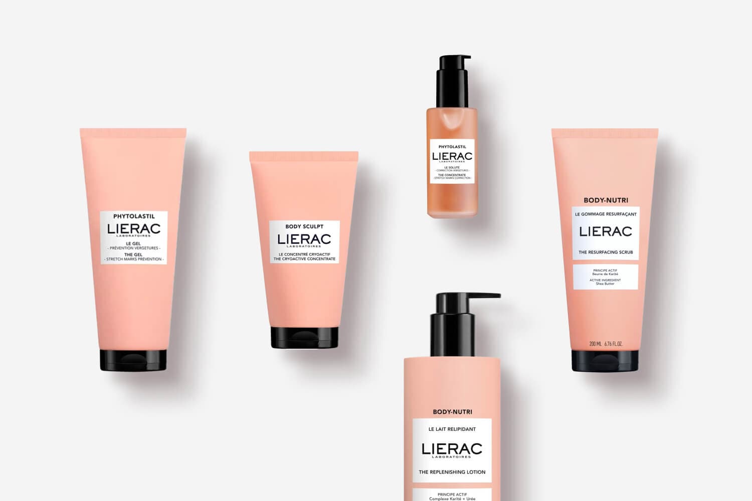 Five peach-toned Lierac body products: Phytolastil Le Gel and Le Soluté, Body Sculpt cryoactive concentrate, Body-Nutri scrub and replenishing lotion.