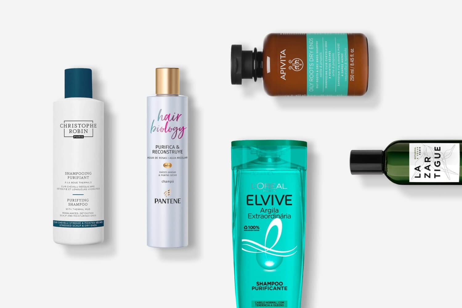 Christophe Robin Purifying Shampoo, Pantene Hair Biology, Apivita, L'Oréal Elvive Argila Extraordinária and Lazartigue bottles on grey. Christophe Robin Purifying Shampoo, Pantene Hair Biology, Apivita, L'Oréal Elvive Argila Extraordinária and Lazartigue bottles on grey.