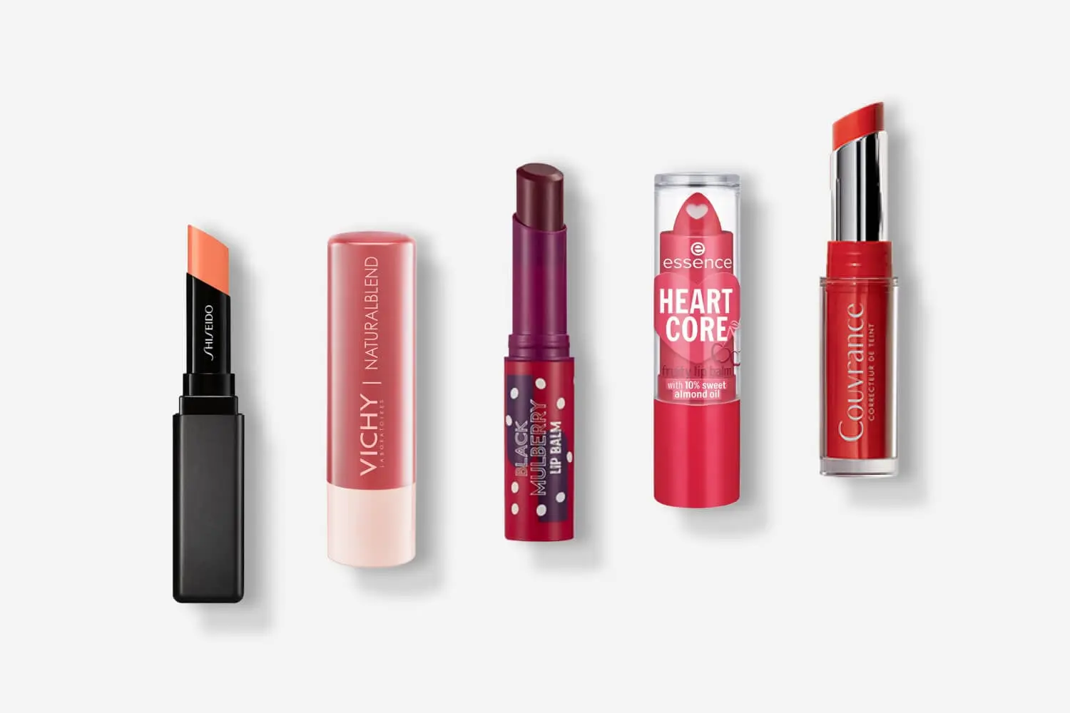 Five lip balms in a row: Shiseido in coral, Vichy Naturalblend, a Black Mulberry Lip Balm, essence Heart Core and Avène Couvrance in red. Five lip balms in a row: Shiseido in coral, Vichy Naturalblend, a Black Mulberry Lip Balm, essence Heart Core and Avène Couvrance in red.