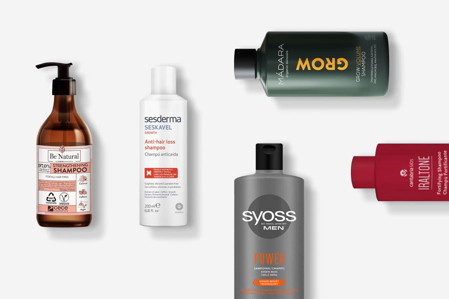 Be Natural Strengthening Shampoo, Sesderma Seskavel Growth, Mádara Grow Volume, Syoss Men Power and Cantabria Labs Iraltone bottles on grey. Be Natural Strengthening Shampoo, Sesderma Seskavel Growth, Mádara Grow Volume, Syoss Men Power and Cantabria Labs Iraltone bottles on grey.