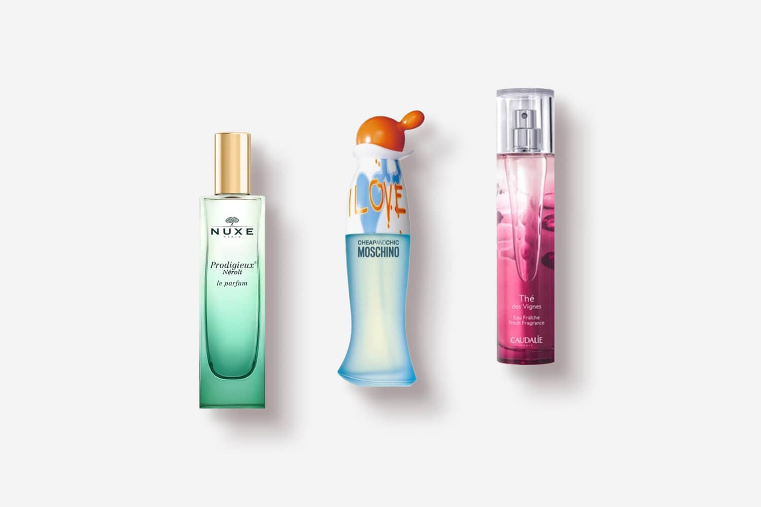 Nuxe Prodigieux Néroli Le Parfum, Moschino Cheap and Chic I Love Love and Caudalie Thé des Vignes Eau Fraîche bottles on white. Nuxe Prodigieux Néroli Le Parfum, Moschino Cheap and Chic I Love Love and Caudalie Thé des Vignes Eau Fraîche bottles on white.