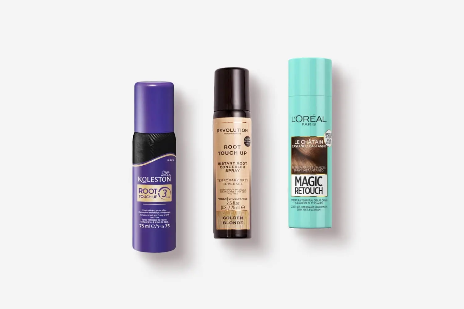 Three root spray cans: Wella Koleston Root Touch Up in Black, Revolution Root Touch Up in Golden Blonde, and L'Oréal Paris Magic Retouch in Le Châtain. Three root spray cans: Wella Koleston Root Touch Up in Black, Revolution Root Touch Up in Golden Blonde, and L'Oréal Paris Magic Retouch in Le Châtain.