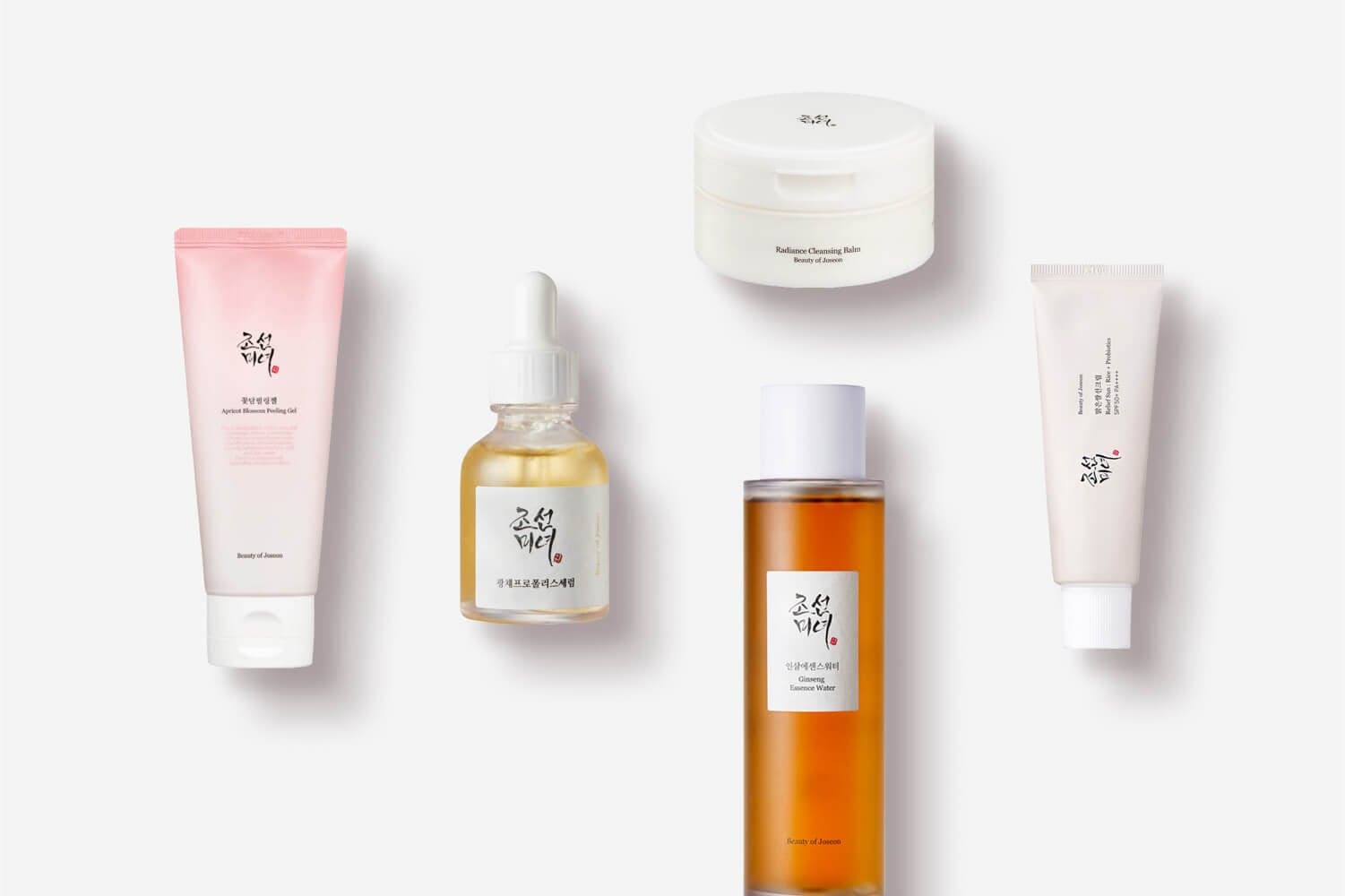 Beauty of Joseon Apricot Blossom Peeling Gel, Glow Serum, Radiance Cleansing Balm, Ginseng Essence Water and Relief Sun on grey. Beauty of Joseon Apricot Blossom Peeling Gel, Glow Serum, Radiance Cleansing Balm, Ginseng Essence Water and Relief Sun on grey.