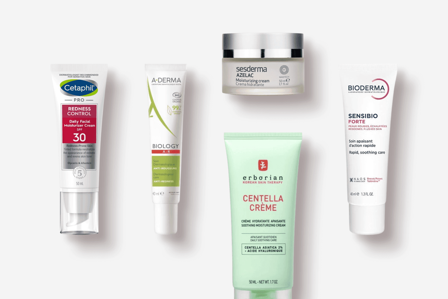 Cetaphil Pro Redness Control SPF 30, A-Derma Biology AR, Sesderma Azelac cream, Erborian Centella Crème and Bioderma Sensibio Forte on grey. Cetaphil Pro Redness Control SPF 30, A-Derma Biology AR, Sesderma Azelac cream, Erborian Centella Crème and Bioderma Sensibio Forte on grey.