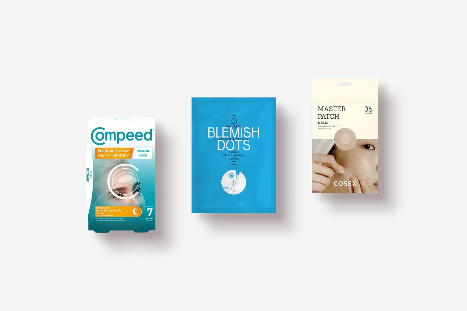 Compeed anti-pimple patches, Youth Lab Blemish Dots and COSRX Master Patch Basic packs side by side on grey Compeed anti-pimple patches, Youth Lab Blemish Dots and COSRX Master Patch Basic packs side by side on grey