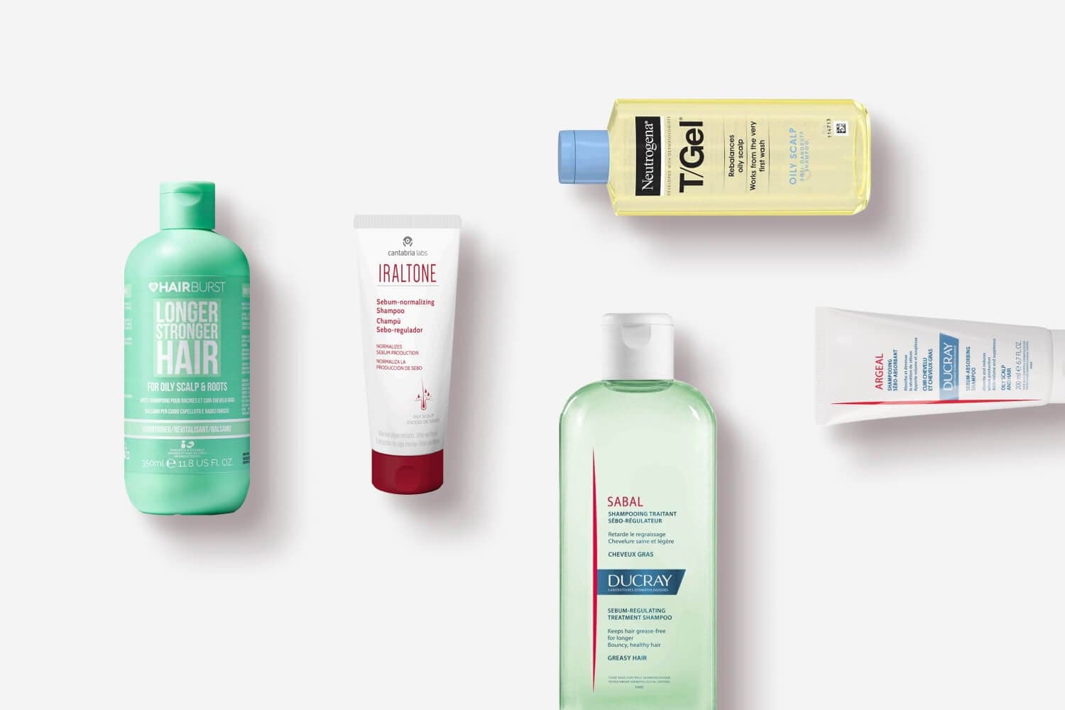 Hairburst Longer Stronger Hair, Cantabria Labs Iraltone, Neutrogena T/Gel Oily Scalp, Ducray Sabal and Ducray Argeal arranged on grey. Hairburst Longer Stronger Hair, Cantabria Labs Iraltone, Neutrogena T/Gel Oily Scalp, Ducray Sabal and Ducray Argeal arranged on grey.