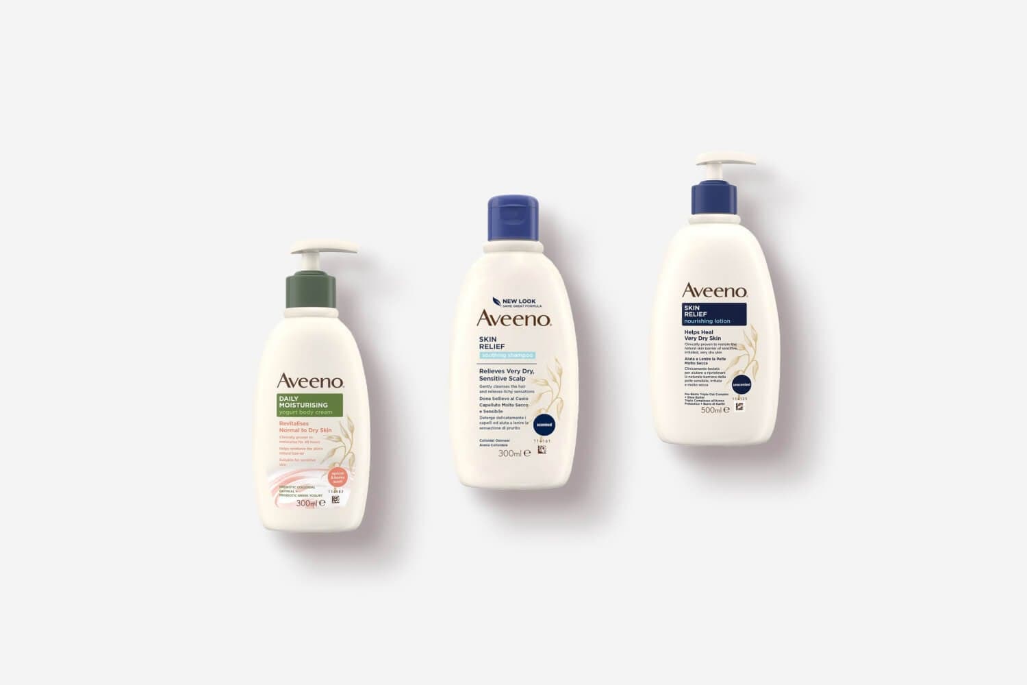 Aveeno Daily Moisturising Yogurt Body Cream 300ml, Skin Relief Soothing Shampoo 300ml and Skin Relief Nourishing Lotion 500ml on white. Aveeno Daily Moisturising Yogurt Body Cream 300ml, Skin Relief Soothing Shampoo 300ml and Skin Relief Nourishing Lotion 500ml on white.