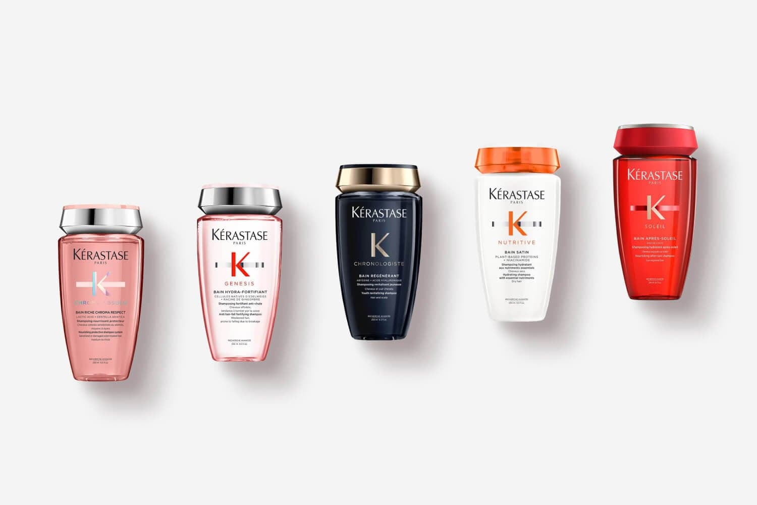 Five Kérastase shampoo bottles in a row: Chroma Absolu Bain Riche, Genesis Bain Hydra-Fortifiant, Chronologiste, Nutritive Bain Satin and Soleil. Five Kérastase shampoo bottles in a row: Chroma Absolu Bain Riche, Genesis Bain Hydra-Fortifiant, Chronologiste, Nutritive Bain Satin and Soleil.