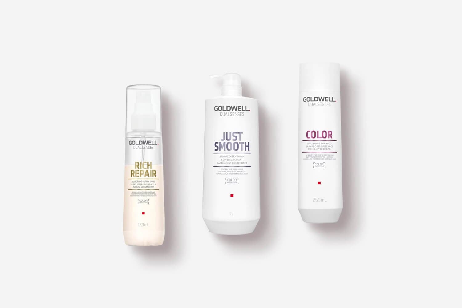 Goldwell Dualsenses Rich Repair Restoring Serum Spray, Just Smooth Taming Conditioner and Color Brilliance Shampoo on grey. Goldwell Dualsenses Rich Repair Restoring Serum Spray, Just Smooth Taming Conditioner and Color Brilliance Shampoo on grey.