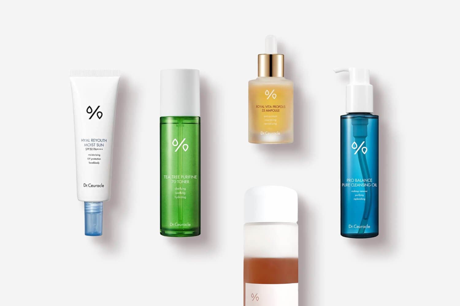 Dr. Ceuracle Hyal Reyouth Moist Sun SPF50, Tea Tree Purifine 70 Toner, Royal Vita Propolis 33 Ampoule and Pro Balance Pure Cleansing Oil on grey. Dr. Ceuracle Hyal Reyouth Moist Sun SPF50, Tea Tree Purifine 70 Toner, Royal Vita Propolis 33 Ampoule and Pro Balance Pure Cleansing Oil on grey.