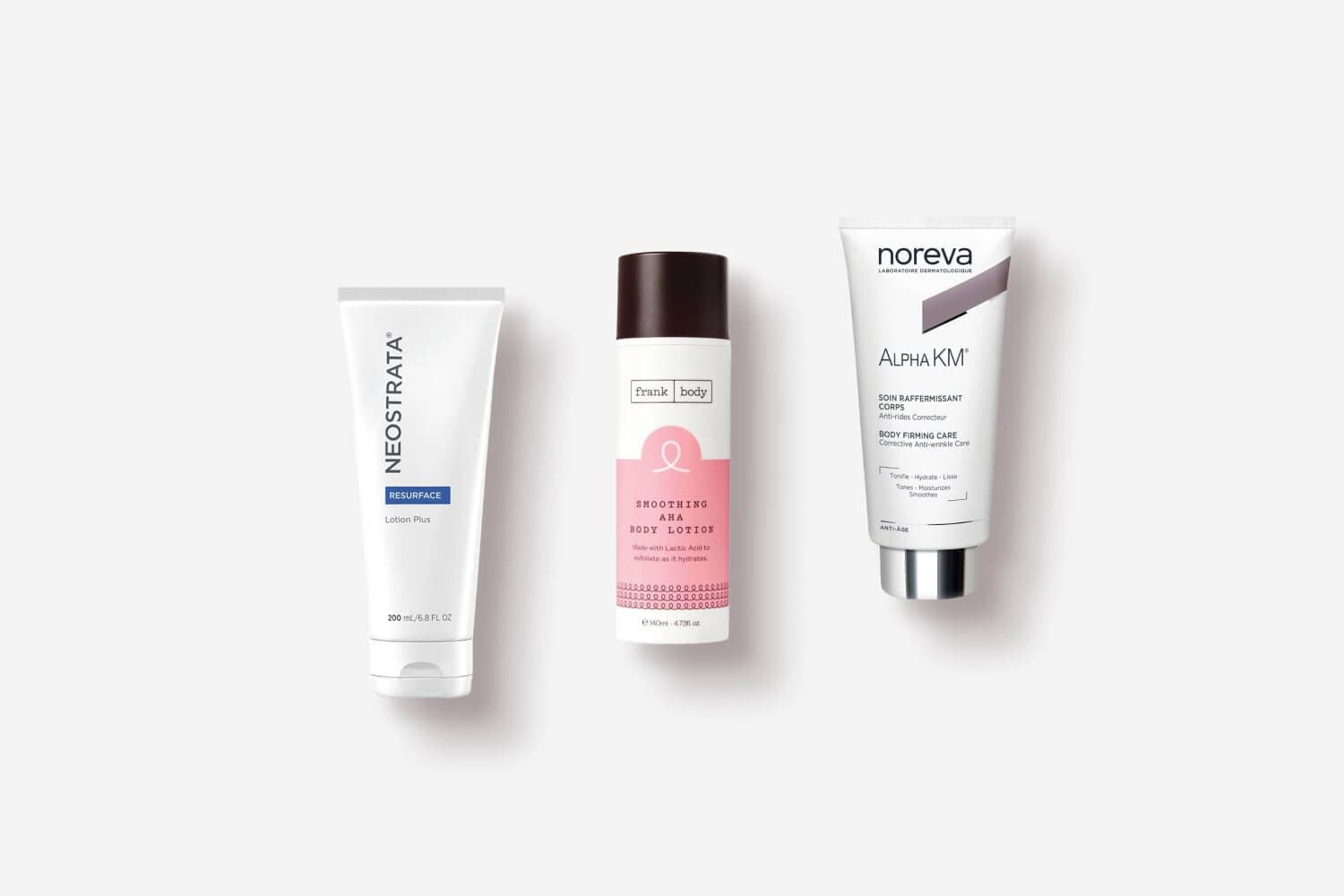 NeoStrata Resurface Lotion Plus, Frank Body Smoothing AHA Body Lotion and Noreva Alpha KM Body Firming Care on grey. NeoStrata Resurface Lotion Plus, Frank Body Smoothing AHA Body Lotion and Noreva Alpha KM Body Firming Care on grey.