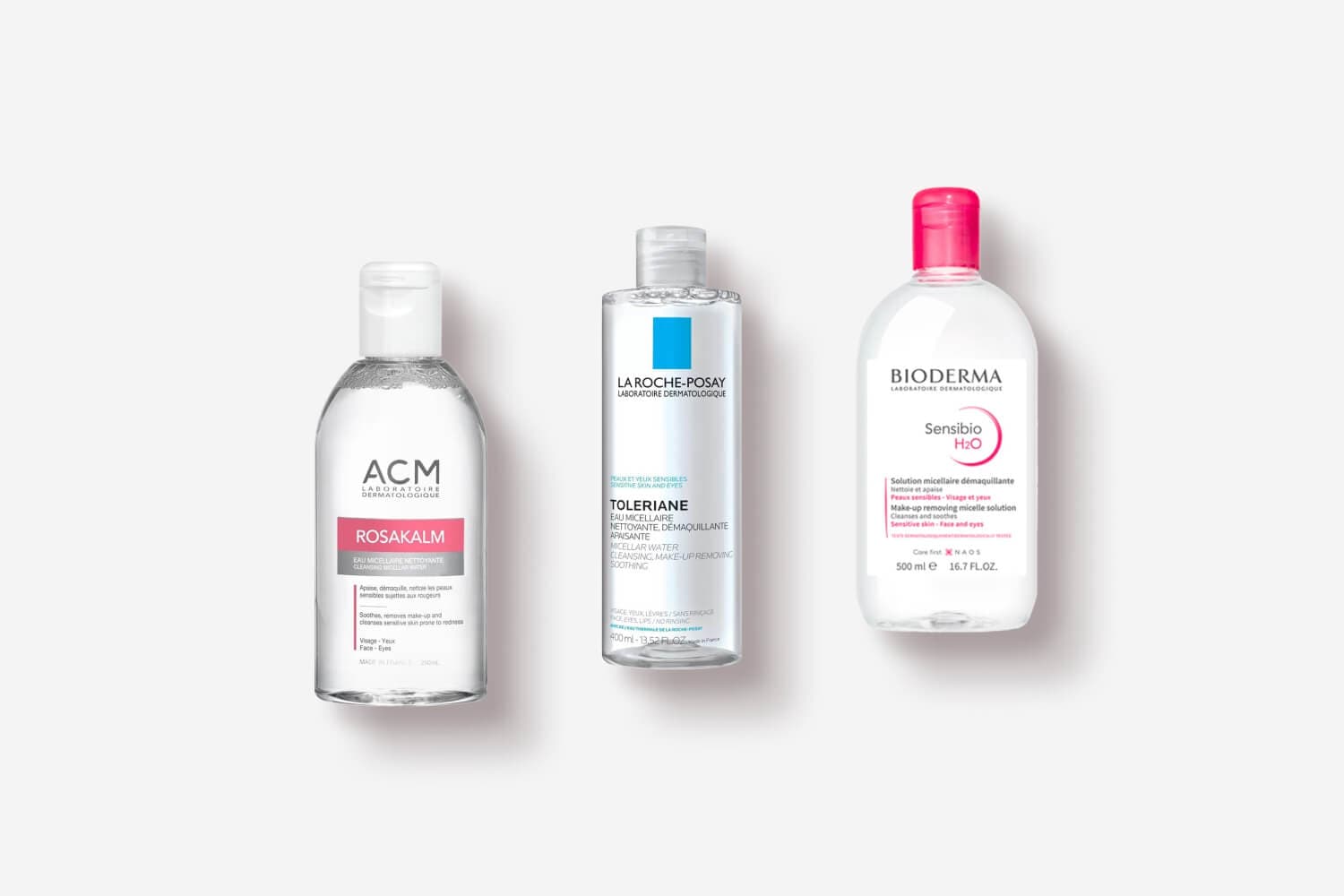 ACM Rosakalm, La Roche-Posay Toleriane 400 ml and Bioderma Sensibio H2O 500 ml micellar waters side by side on grey. ACM Rosakalm, La Roche-Posay Toleriane 400 ml and Bioderma Sensibio H2O 500 ml micellar waters side by side on grey.
