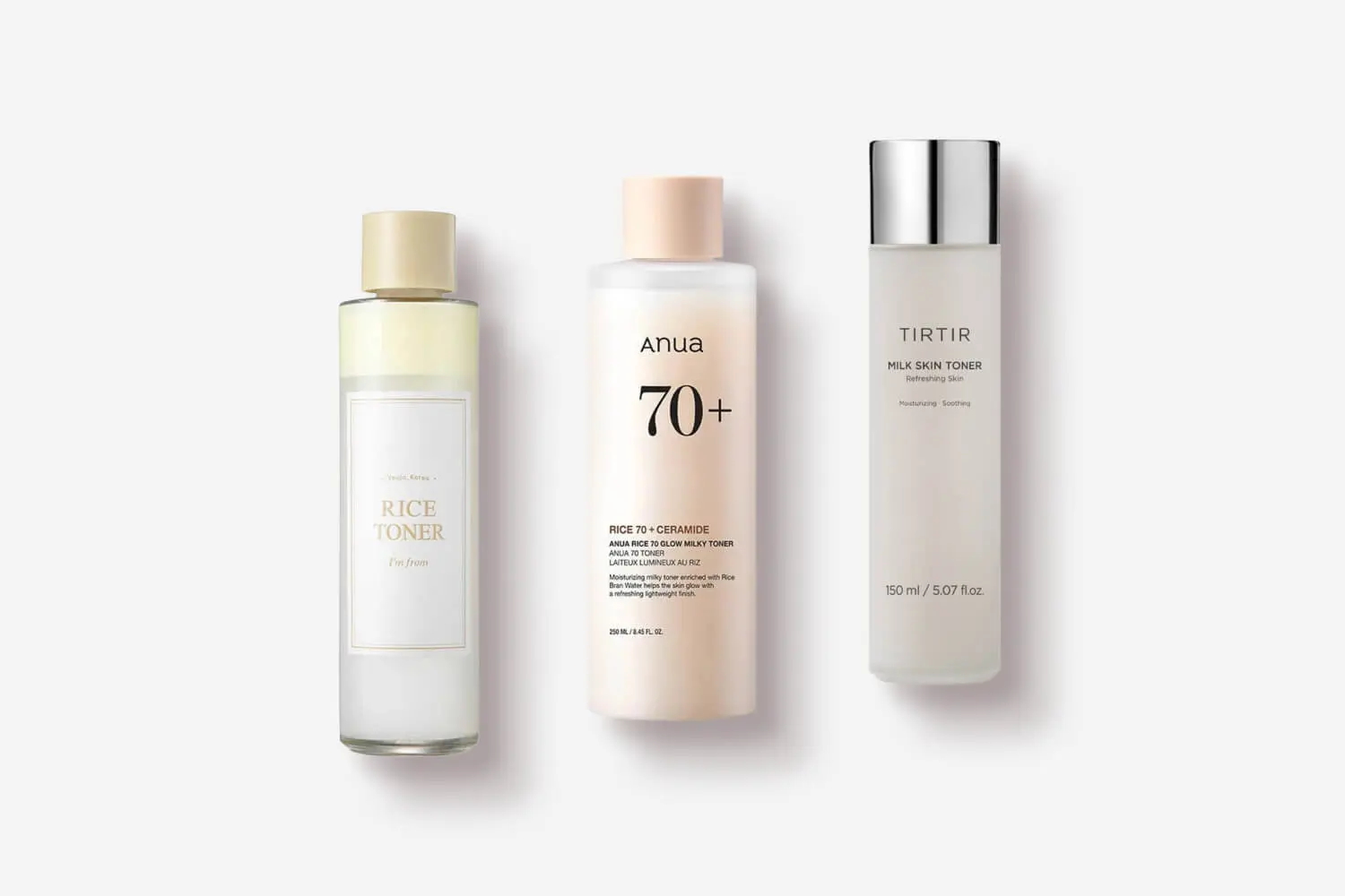 I'm from Rice Toner, Anua Rice 70 + Ceramide Glow Milky Toner and TIRTIR Milk Skin Toner lined up on grey. I'm from Rice Toner, Anua Rice 70 + Ceramide Glow Milky Toner and TIRTIR Milk Skin Toner lined up on grey.