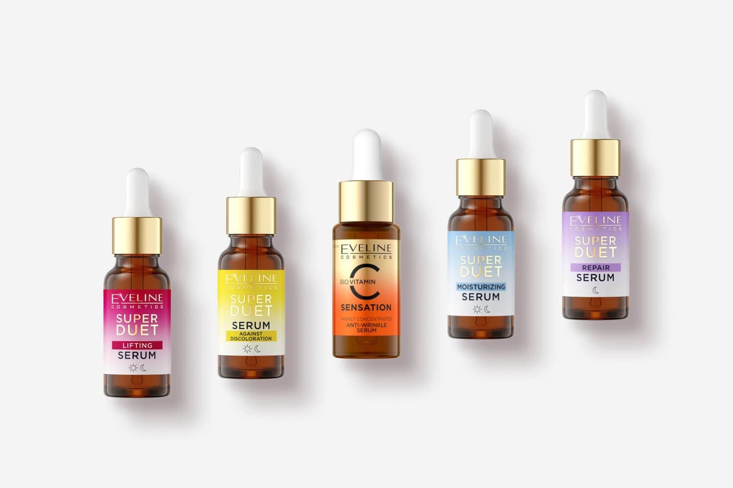 Five Eveline Cosmetics dropper bottles: Super Duet Lifting, Against Discoloration, Bio Vitamin C Sensation, Moisturizing and Repair serums.