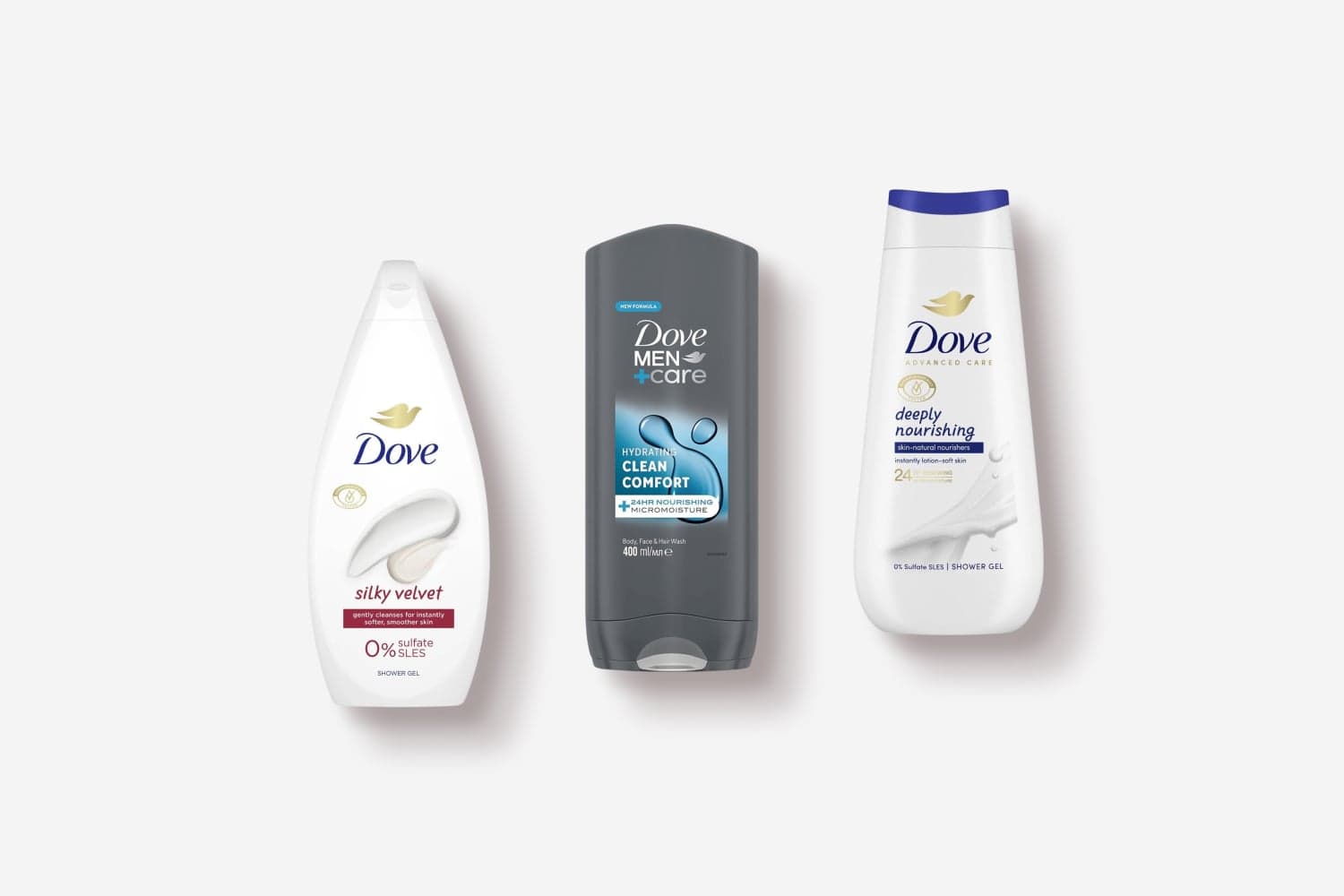 Dove Silky Velvet shower gel, Dove Men+Care Clean Comfort body wash and Dove Advanced Care Deeply Nourishing shower gel on grey. Dove Silky Velvet shower gel, Dove Men+Care Clean Comfort body wash and Dove Advanced Care Deeply Nourishing shower gel on grey.