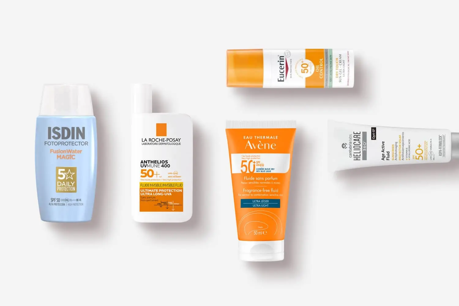 ISDIN Fusion Water Magic, La Roche-Posay Anthelios UVMune 400, Eucerin Oil Control, Avène and Heliocare 360 SPF 50+ sunscreens on white ISDIN Fusion Water Magic, La Roche-Posay Anthelios UVMune 400, Eucerin Oil Control, Avène and Heliocare 360 SPF 50+ sunscreens on white