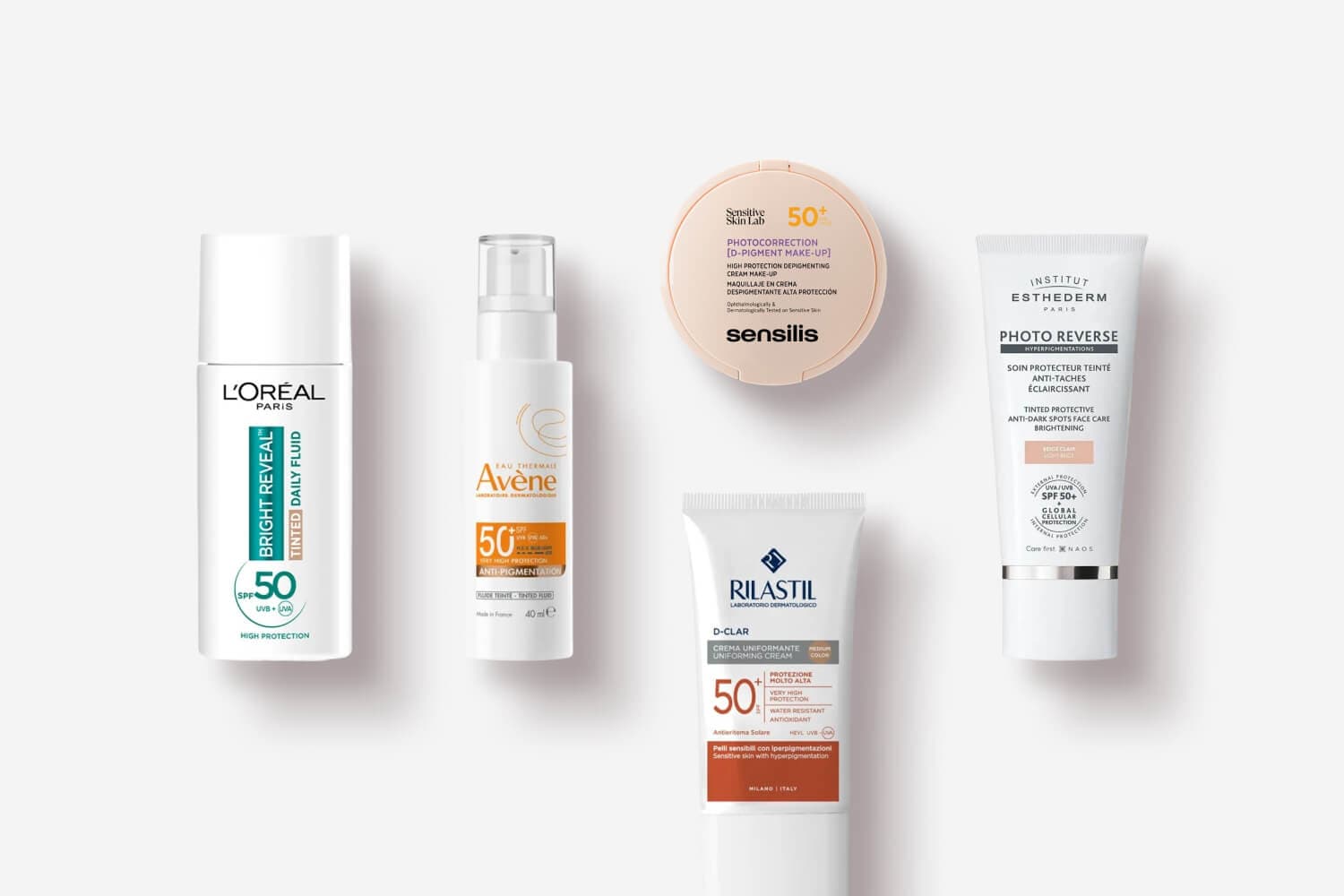 L'Oréal Bright Reveal Tinted Daily Fluid SPF 50, Avène Anti-Pigmentation SPF 50+, Sensilis Photocorrection compact, Rilastil D-Clar and Esthederm Photo Reverse L'Oréal Bright Reveal Tinted Daily Fluid SPF 50, Avène Anti-Pigmentation SPF 50+, Sensilis Photocorrection compact, Rilastil D-Clar and Esthederm Photo Reverse