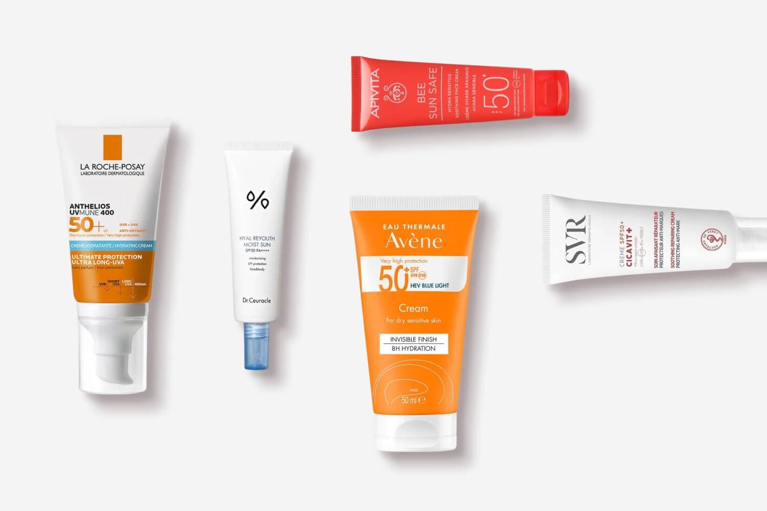 La Roche-Posay Anthelios UVMune 400, Dr.Ceuracle Hyal Reyouth Moist Sun, Apivita Bee Sun Safe, Avène SPF50+ Cream and SVR Cicavit+ tubes on grey. La Roche-Posay Anthelios UVMune 400, Dr.Ceuracle Hyal Reyouth Moist Sun, Apivita Bee Sun Safe, Avène SPF50+ Cream and SVR Cicavit+ tubes on grey.