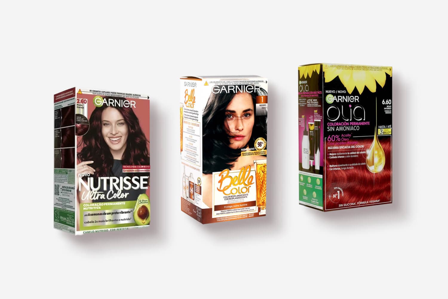 Three Garnier dye boxes side by side: Nutrisse Ultra Color 2.60 Preto Cereja, Belle Color 1 Negro, and Olia 6.60 Rojo Intenso. Three Garnier dye boxes side by side: Nutrisse Ultra Color 2.60 Preto Cereja, Belle Color 1 Negro, and Olia 6.60 Rojo Intenso.